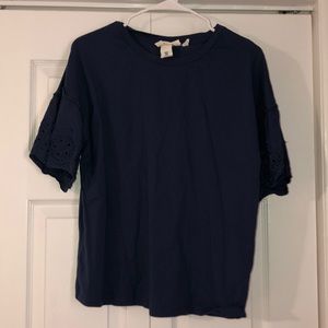 Navy top with detailed bell sleeves